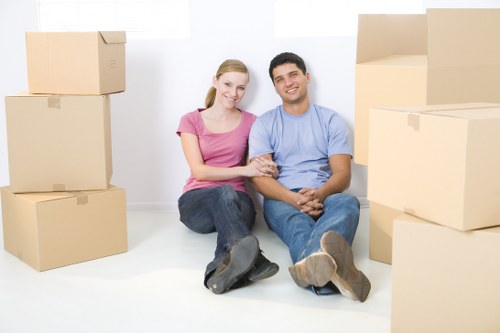 Packed household boxes and furniture ready for transport in North West London