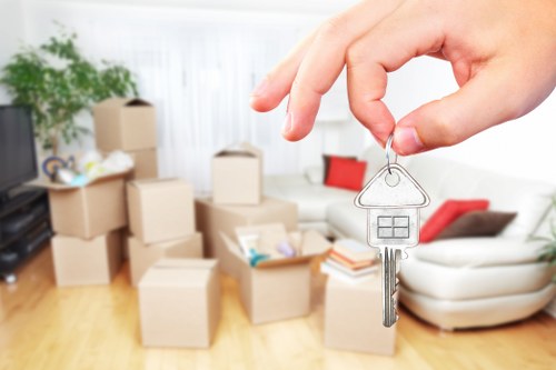 Moving boxes and furniture being prepared for a home move in Belsize Park