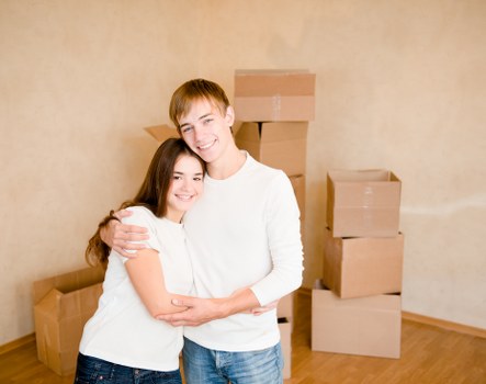 Professional movers handling furniture in a local flat in Belsize Park