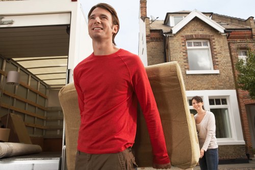 Packed boxes and wrapped furniture ready for a local move in Belsize Park