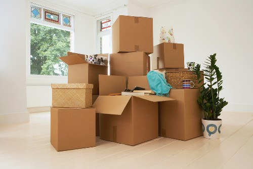 Professional movers packing and loading furniture for a Belsize Park home move