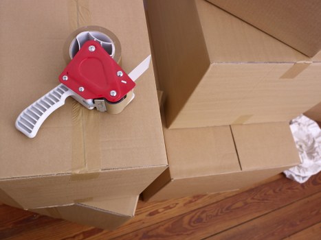 Staff carrying out careful manual handling during a removal