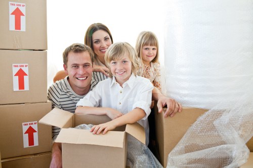 Local removals crew transporting household items from a period property