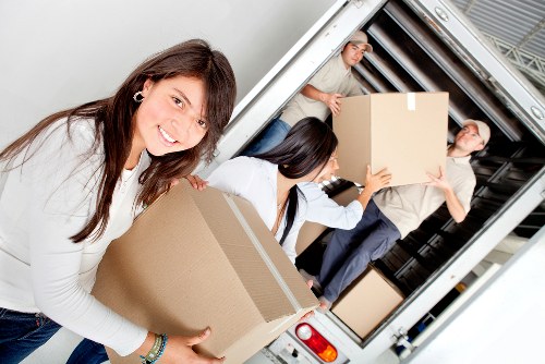 Local furniture collection service loading items for removal