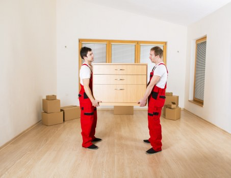 Unpacking boxes and organizing rooms in a new Belsize Park property