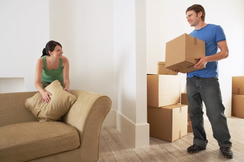 Loading household items into van near Belsize Park